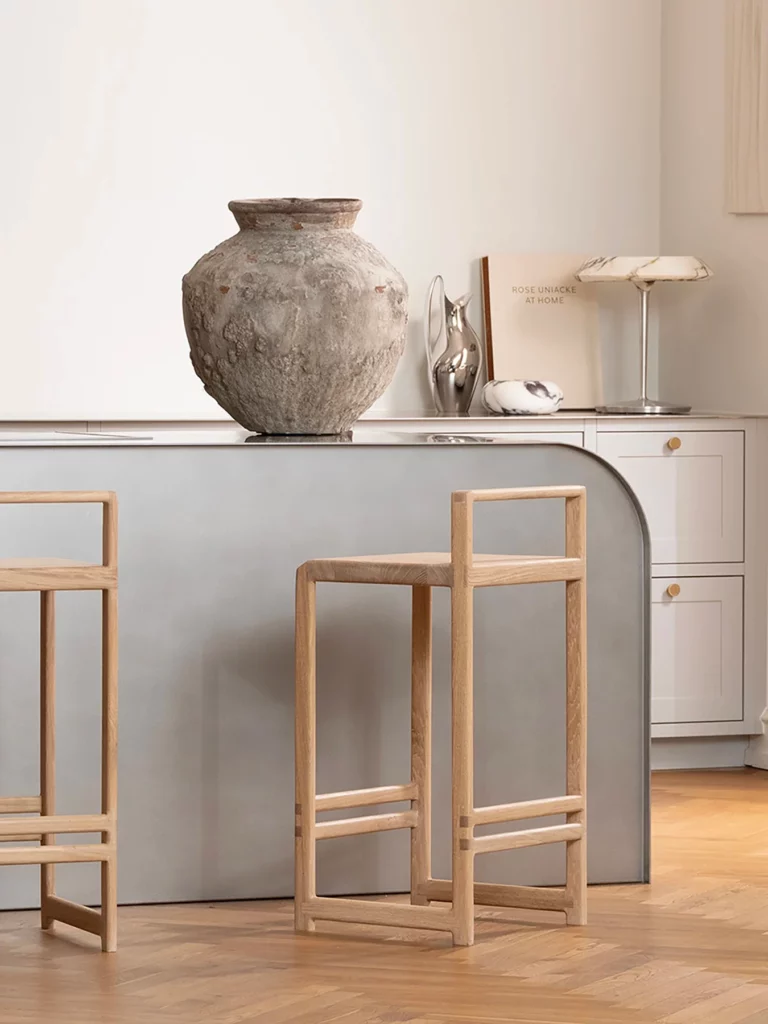 minimalist curved kitchen island oak ebba bar stools textured ceramic vase